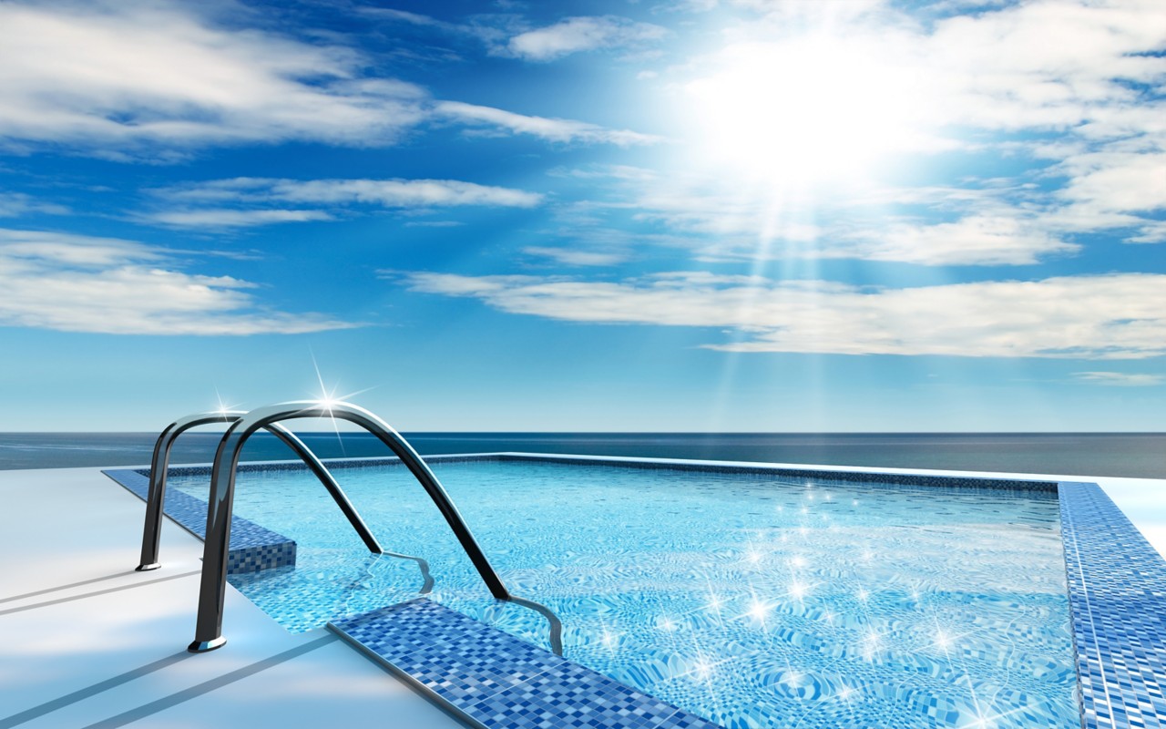 阳光闪闪发光的蓝色户外游泳池附近的海洋清澈的蓝天＂title=